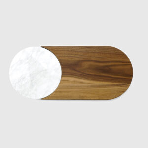 A wooden board with a white round on it.