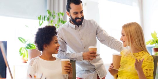 A group of people that are drinking coffee.