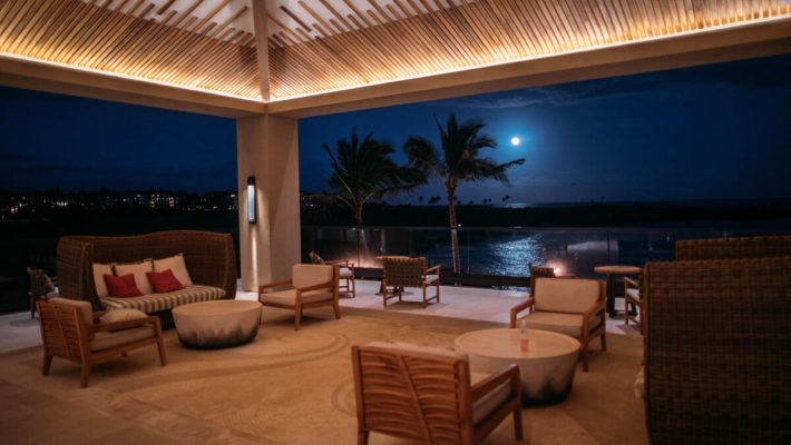 A patio with furniture and a fire pit.